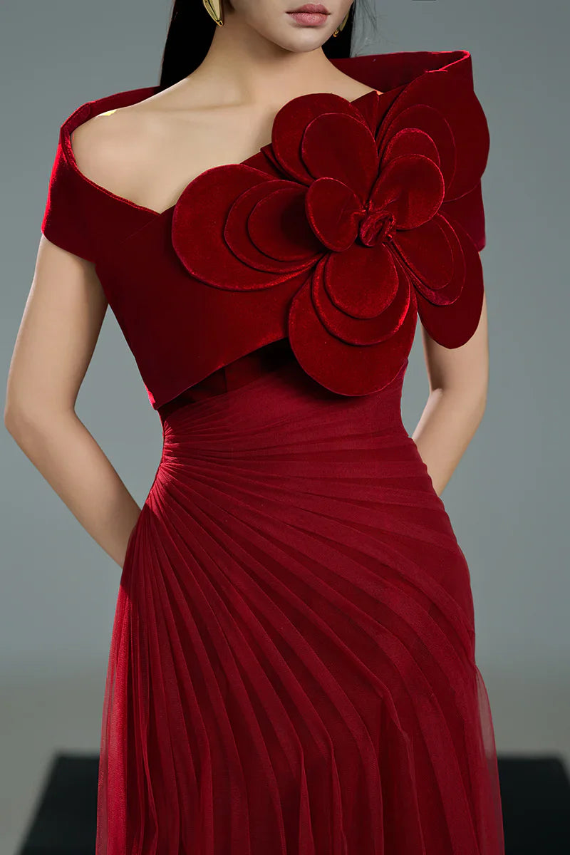 Off-shoulder pleated gown with oversized floral detail – ODD- SCARFAH