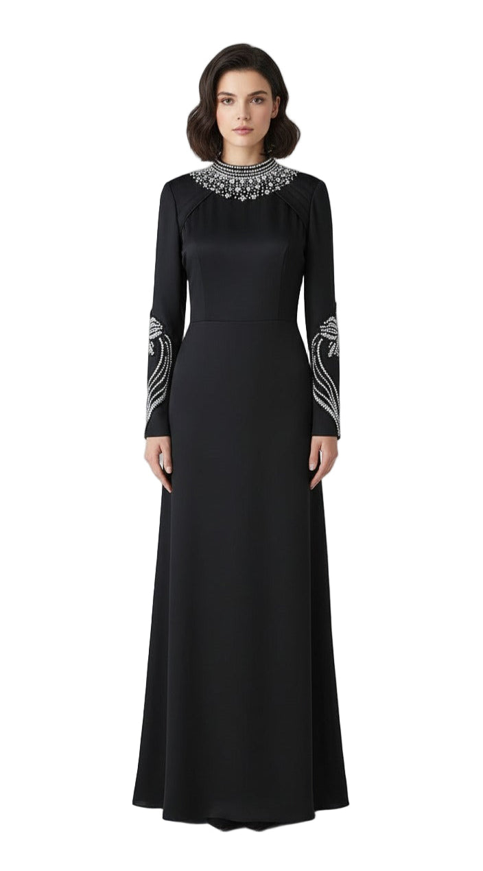 Black evening gown with silver embellishments on a white background