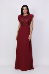 sleeveless gown with sequined bodice and structured cape shoulders – ODD- RELYE