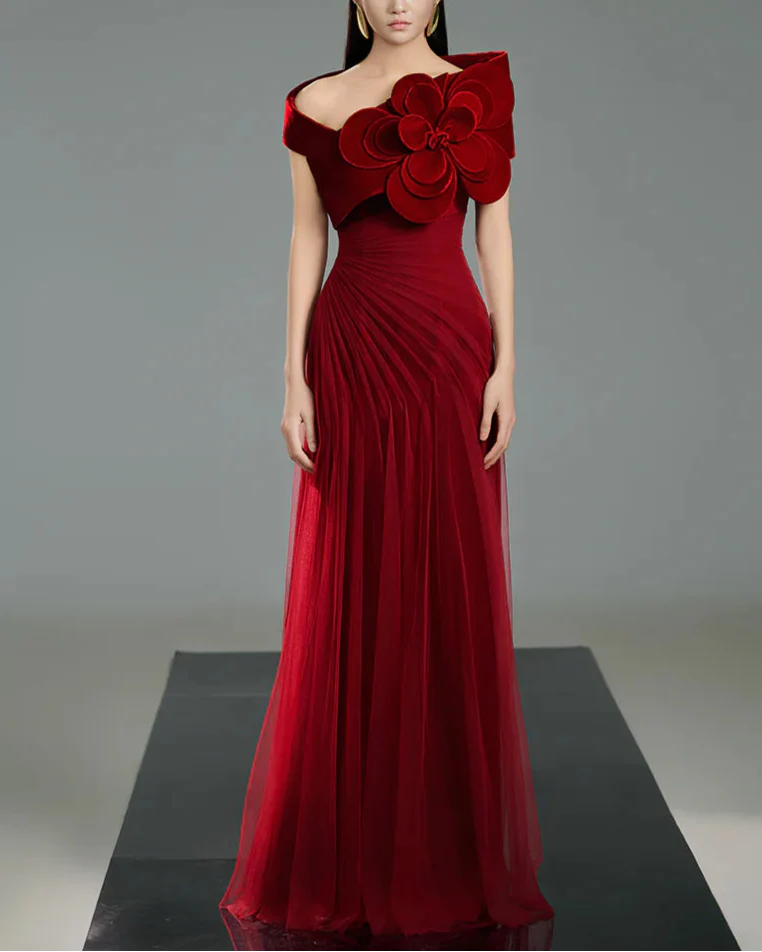 Off-shoulder pleated gown with oversized floral detail –  ODD- SCARFAH