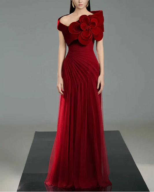 Off-shoulder pleated gown with oversized floral detail –  ODD- SCARFAH