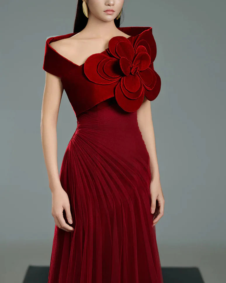 Off-shoulder pleated gown with oversized floral detail –  ODD- SCARFAH