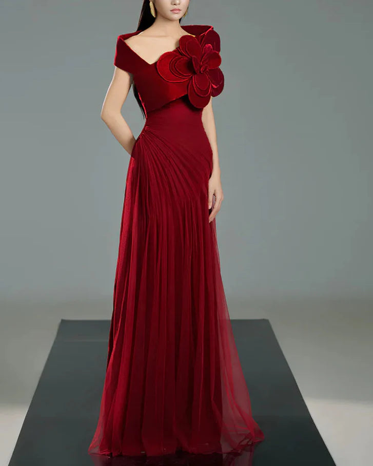 Off-shoulder pleated gown with oversized floral detail –  ODD- SCARFAH