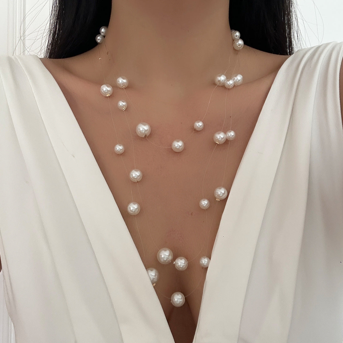 floating pearl strand necklace with layered illusion threads – ODD- AUIRO