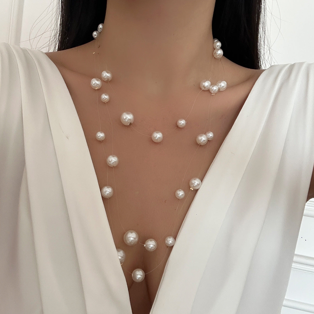 floating pearl strand necklace with layered illusion threads – ODD- AUIRO
