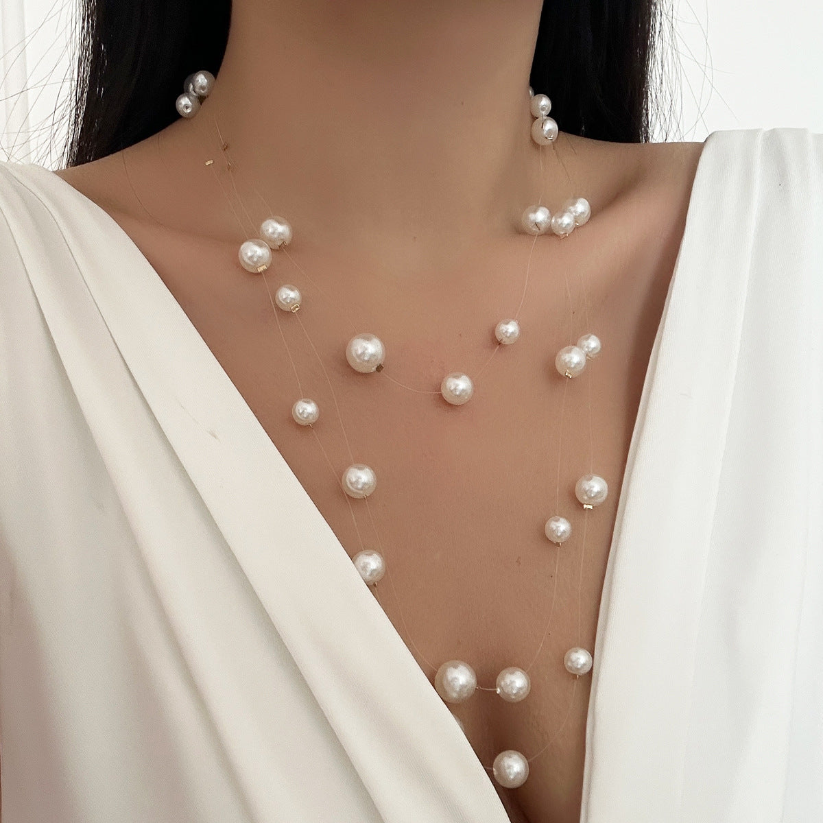 floating pearl strand necklace with layered illusion threads – ODD- AUIRO