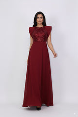 sleeveless gown with sequined bodice and structured cape shoulders – ODD- RELYE